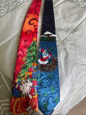 2 men’s ties-J. Garcia Red & Orange Christmas tie, Steven Harris Christmas tie.